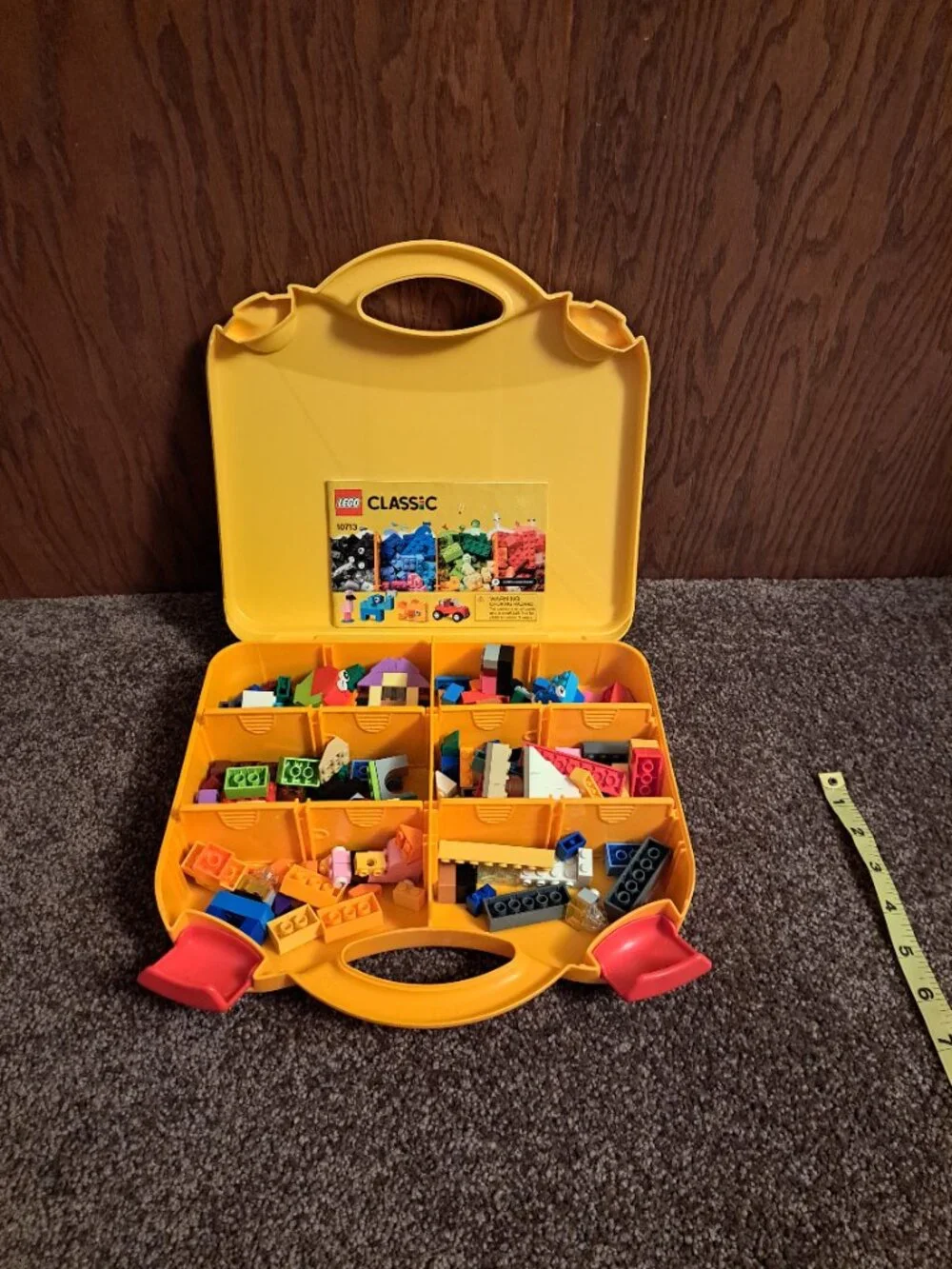 2018 LEGO Classic Creative Suitcase (10713) filled with an assortment of Legos